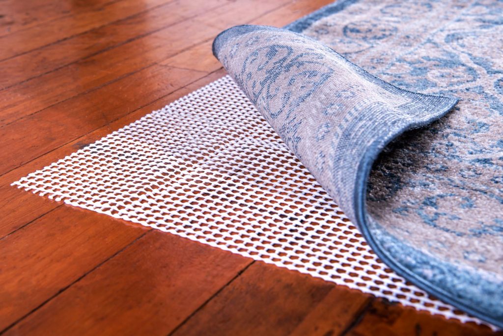 Do You Really Need A Rug Pad Floorspace, How To Keep A Rug From Slipping On Wood Floor